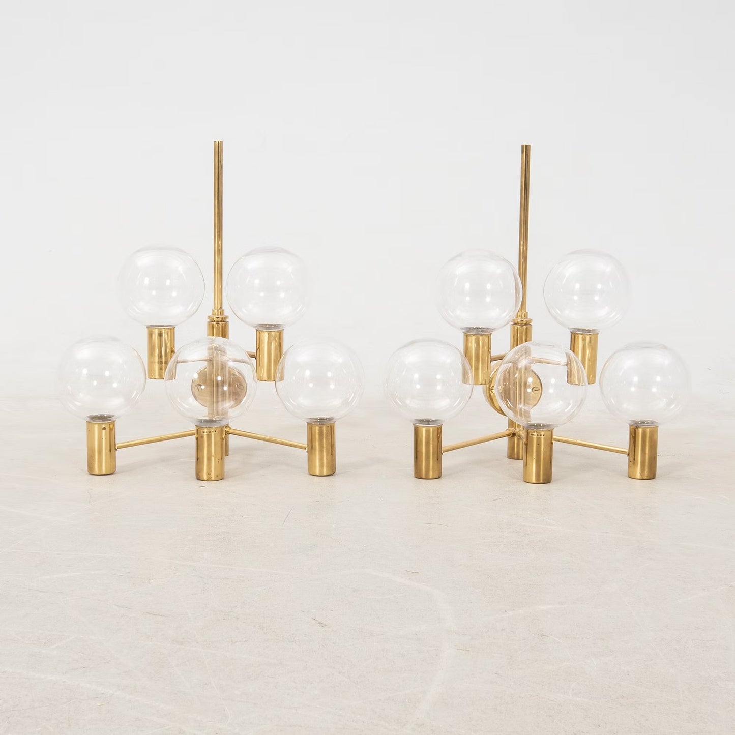 Hans-Agne Jakobsson Wall lamps clear glass and brass a pair Sweden 1960