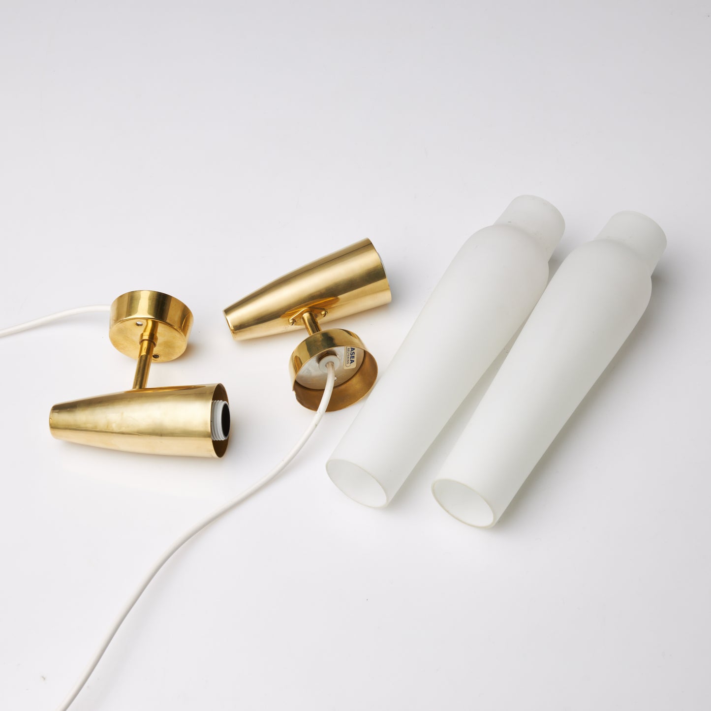 Asea wall lights a pair in brass and glass Sweden 1960