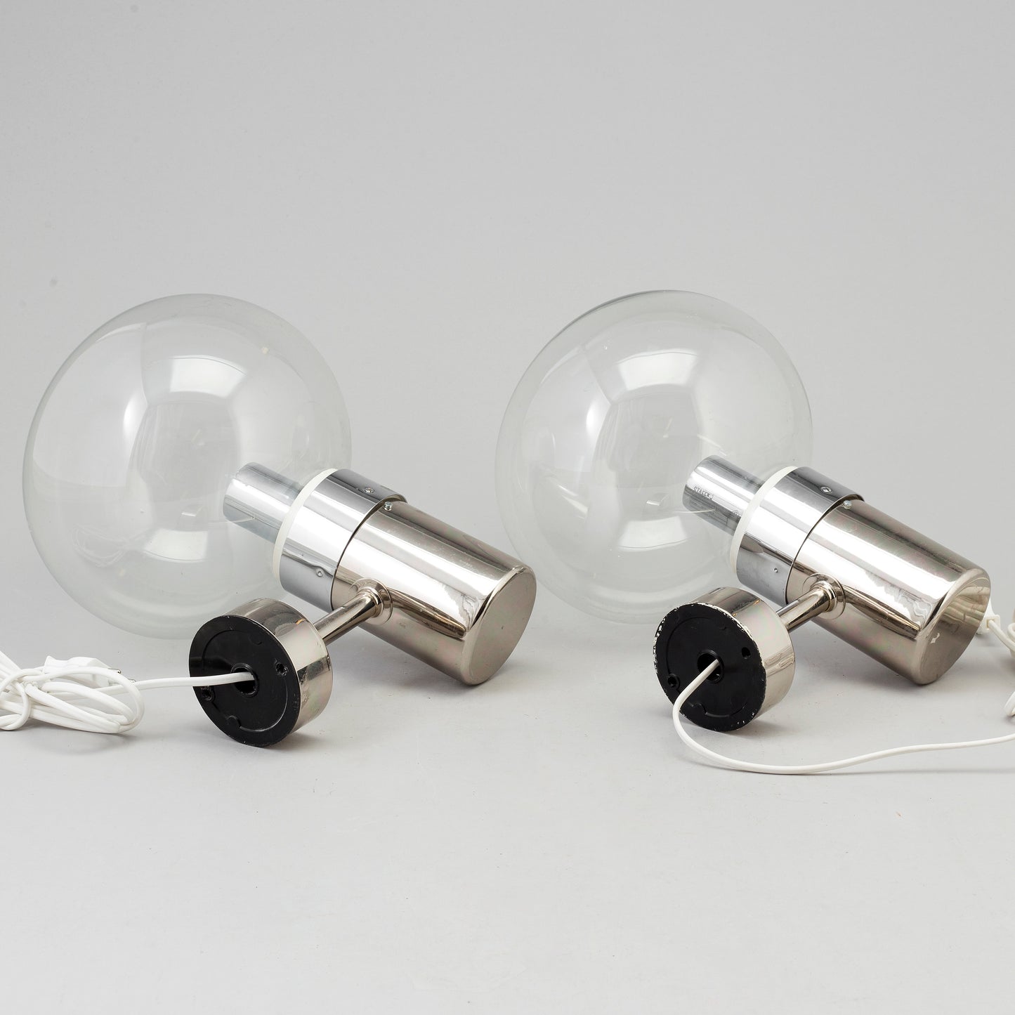 A pair of wall lamps by STEFF Chrome and Glass Germany c. 1980